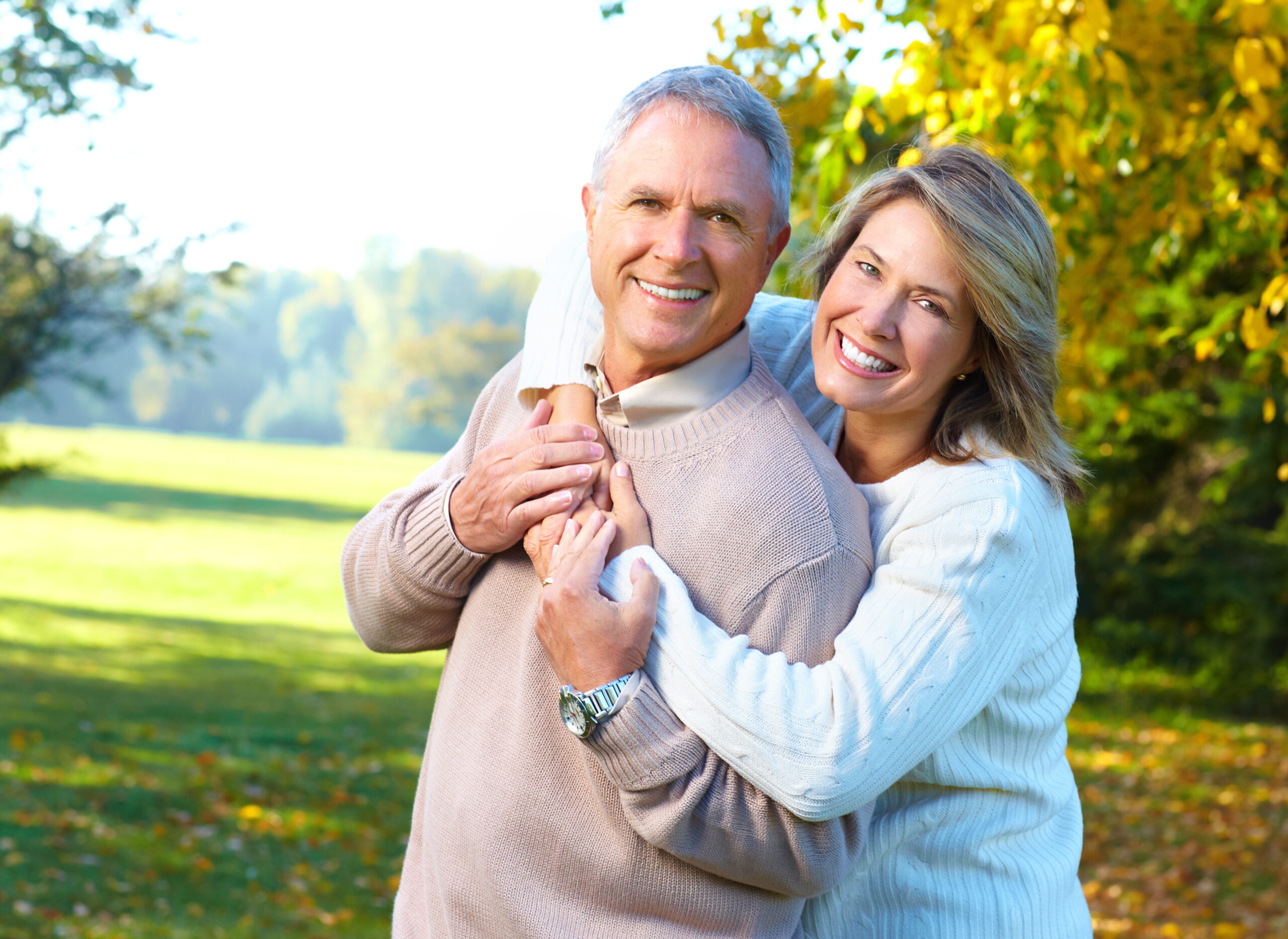 happy elderly couple in park