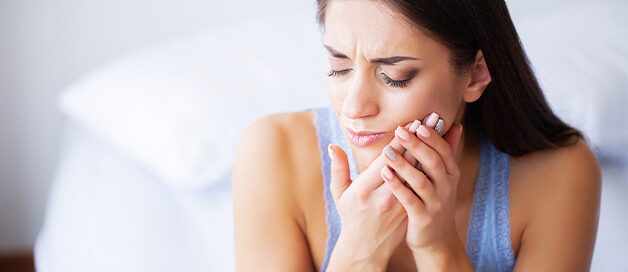 Patient with severe tooth pain needing an emergency dentist in Gresham, OR