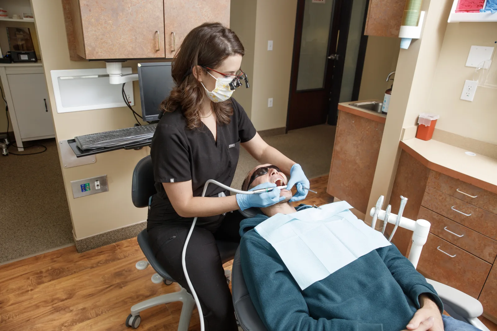 Gresham Advanced Dentistry – Dental Cleaning Dental hygienist providing a cleaning at Gresham Advanced Dentistry in Gresham, Oregon