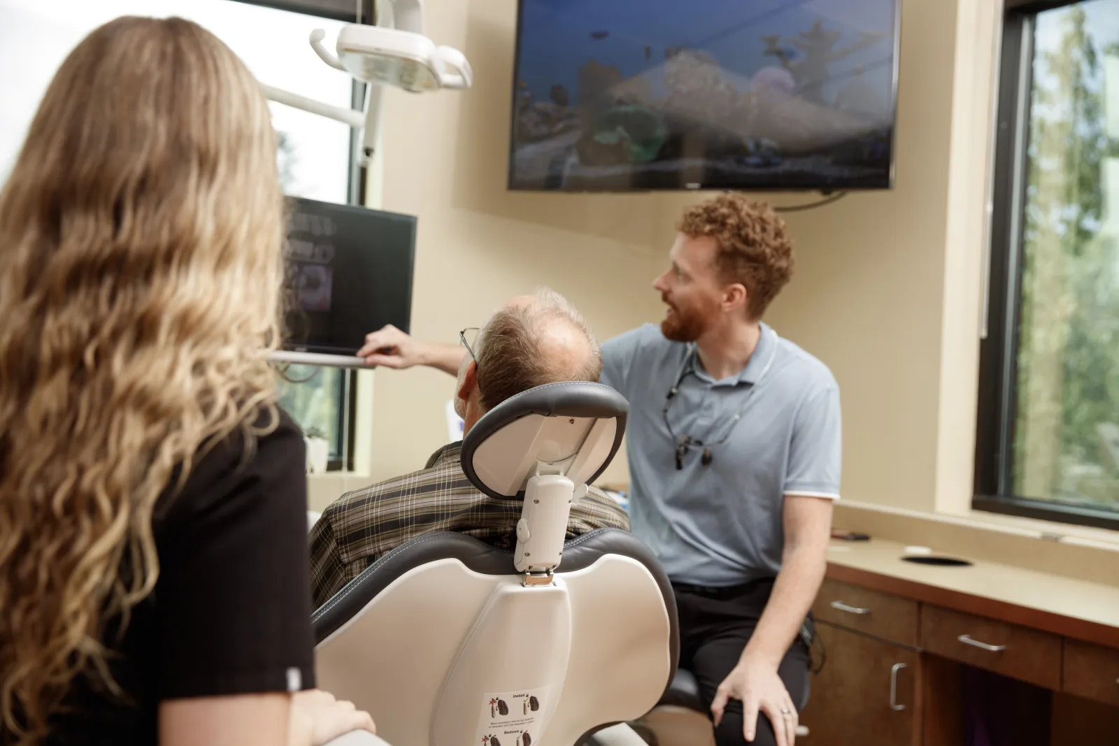 Gresham Advanced Dentistry – Doctor Consultation Dentist explaining treatment to a patient at Gresham Advanced Dentistry