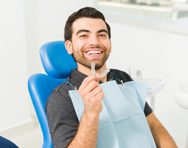Gresham Advanced Dentistry – Invisalign for Adults Adult patient with Invisalign clear aligners at Gresham Advanced Dentistry