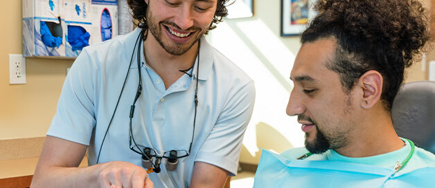 Dentist explaining treatment options to a patient at Gresham Advanced Dentistry in Gresham, OR
