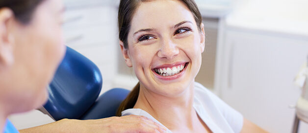 Patient smiling during a dental cleaning and exam at Gresham Advanced Dentistry in Gresham, OR