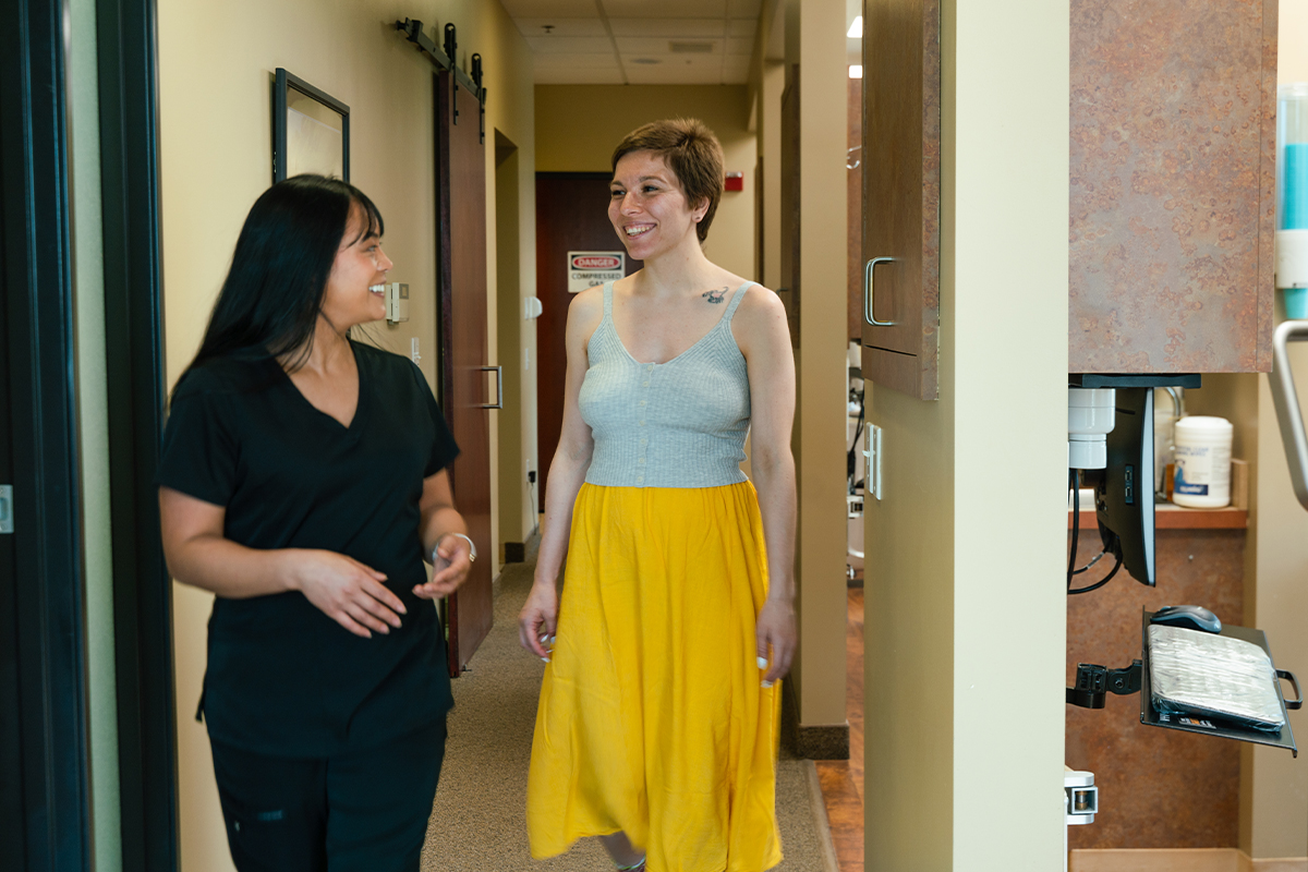 Gresham Advanced Dentistry – Office Tour 7 Team member walking a patient to her appointment at Gresham Advanced Dentistry